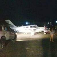 The plane landed on the luminous track only by the headlights of cars